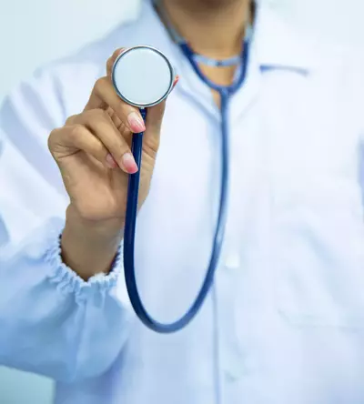 doctor holding up stethoscope