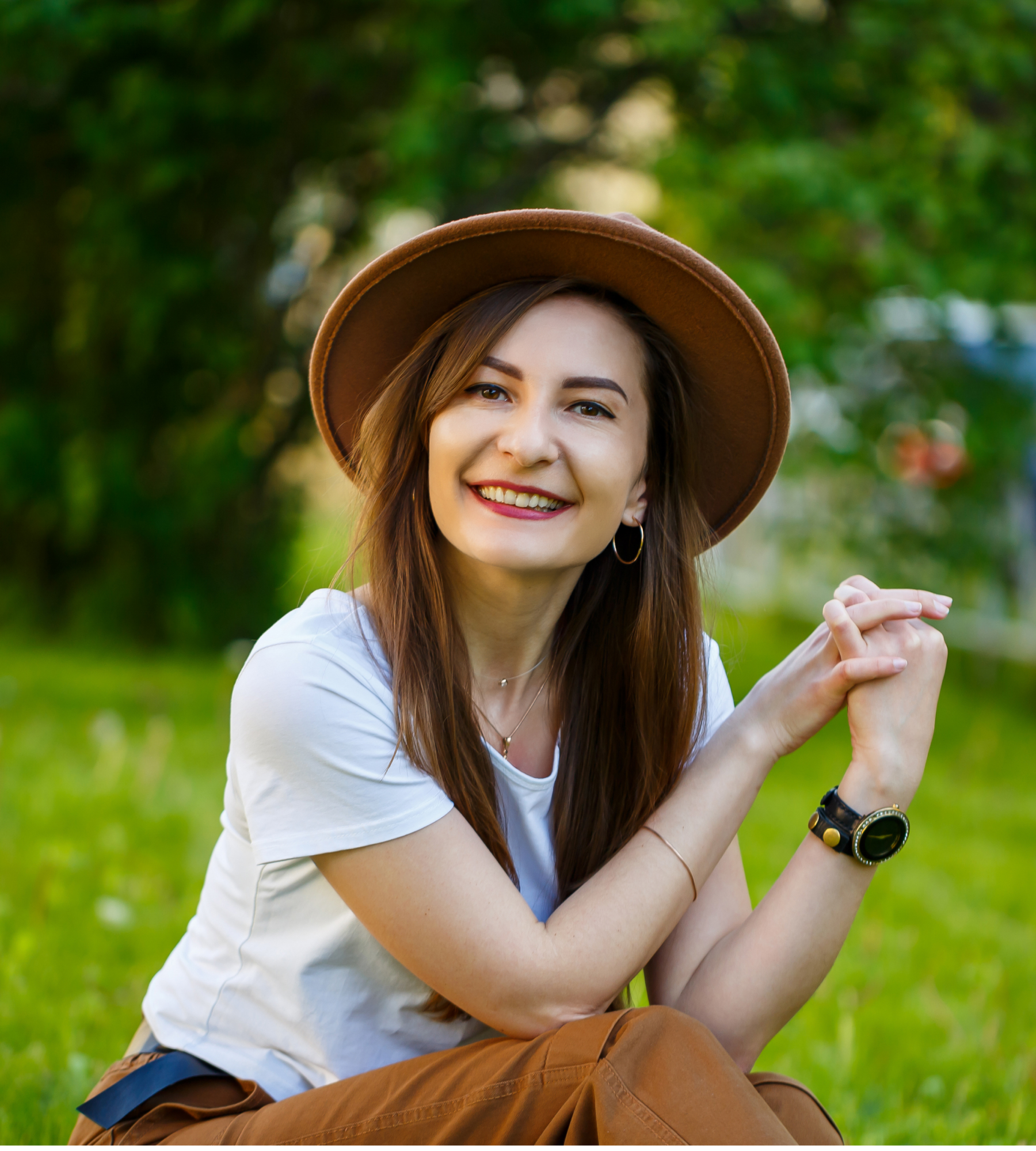 woman sitting outside smiling
